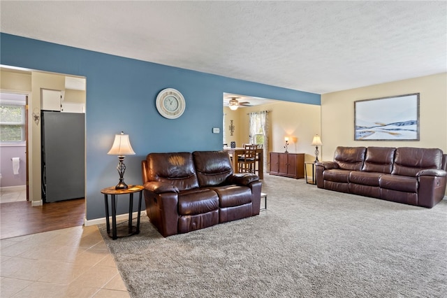 111 Farrell Road Ext, Henrietta, NY 14586 - living room with healthy amount of natural light, tile patterned flooring, ceiling fan, and a textured ceiling