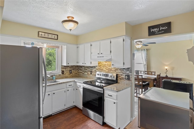 111 Farrell Road Ext, Henrietta, NY 14586 - kitchen with freestanding refrigerator, stainless steel electric range, under cabinet range hood, decorative backsplash, and light countertops