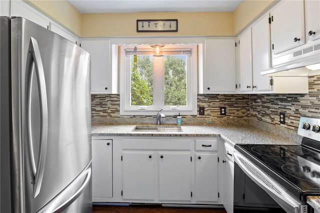 111 Farrell Road Ext, Henrietta, NY 14586 - kitchen featuring stainless steel appliances, under cabinet range hood, white cabinetry, decorative backsplash, and light stone counters