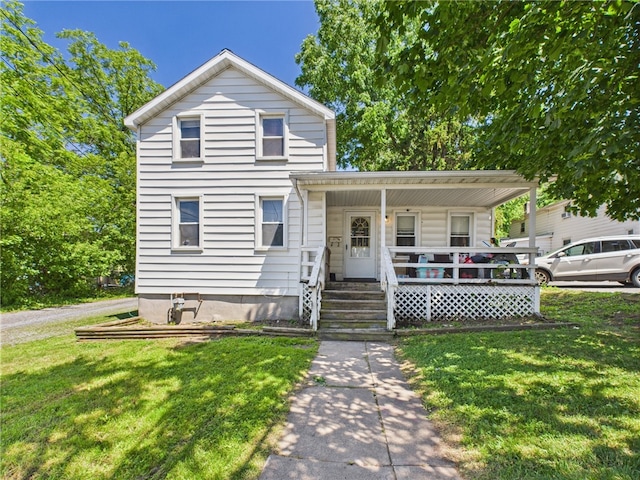 17 Perrine St, Auburn, NY 13021 - view of front of home featuring a porch and a front lawn