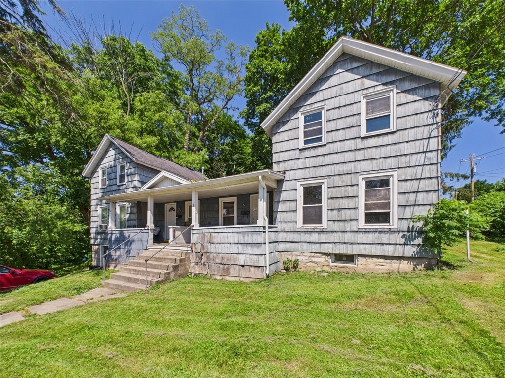 1-3 Lizette St, Auburn, NY 13021 - view of front of house featuring covered porch and a front yard