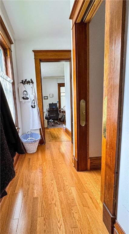 80 E Main St, Leroy, NY 14482 - corridor featuring wood finished floors