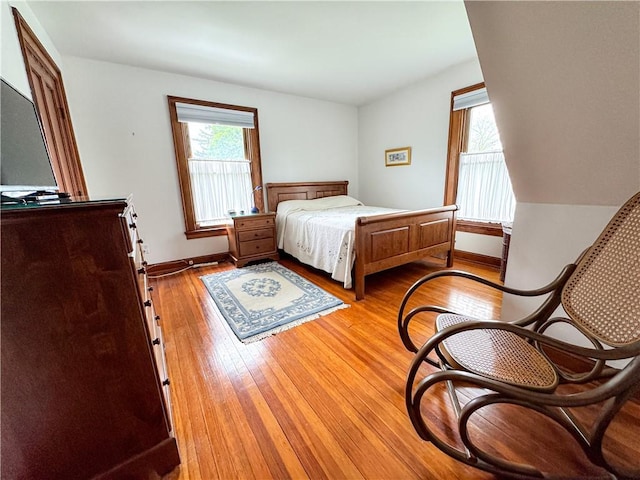 80 E Main St, Leroy, NY 14482 - bedroom with light wood-type flooring and baseboards