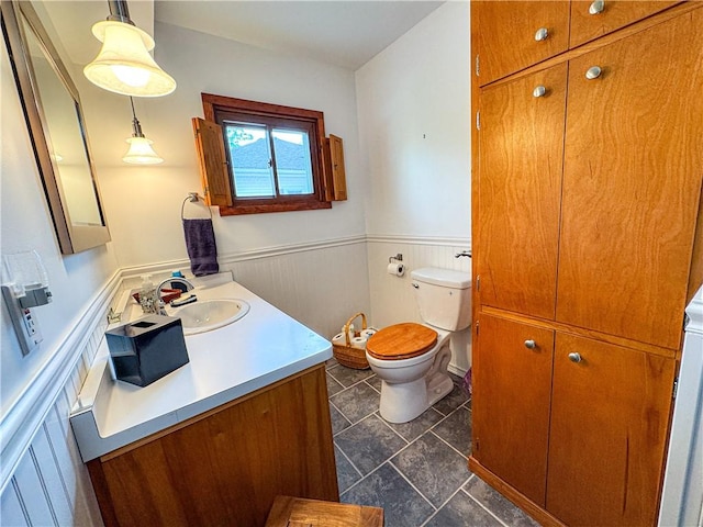 80 E Main St, Leroy, NY 14482 - bathroom with vanity and a wainscoted wall
