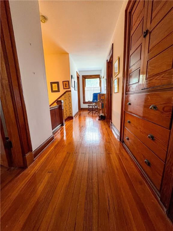 80 E Main St, Leroy, NY 14482 - hall with dark wood finished floors and baseboards