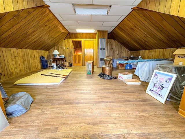 80 E Main St, Leroy, NY 14482 - additional living space with wooden walls, vaulted ceiling, and hardwood / wood-style flooring