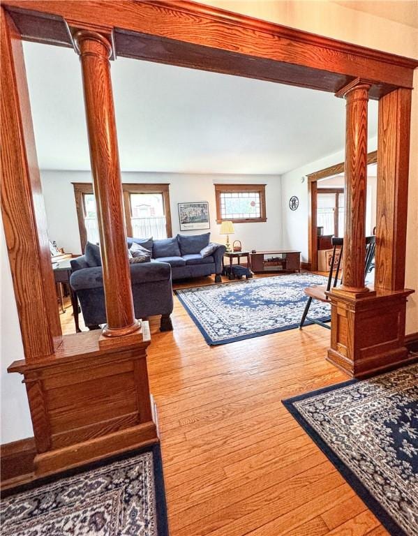 80 E Main St, Leroy, NY 14482 - living room with ornate columns and wood finished floors