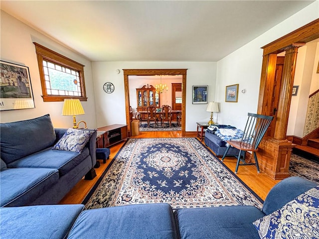80 E Main St, Leroy, NY 14482 - living area with wood finished floors, a chandelier, and ornate columns