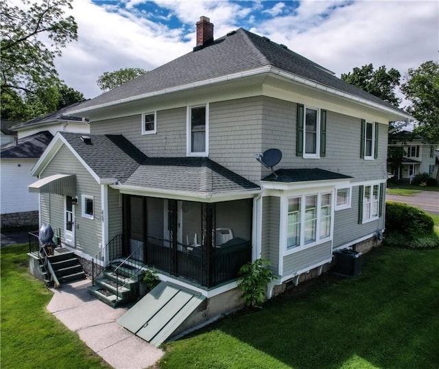 80 E Main St, Leroy, NY 14482 - back of property featuring roof with shingles, a chimney, and a yard