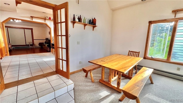7320 E Flats Rd, East Otto, NY 14729 - carpeted dining room featuring tile patterned floors, a baseboard heating unit, and vaulted ceiling