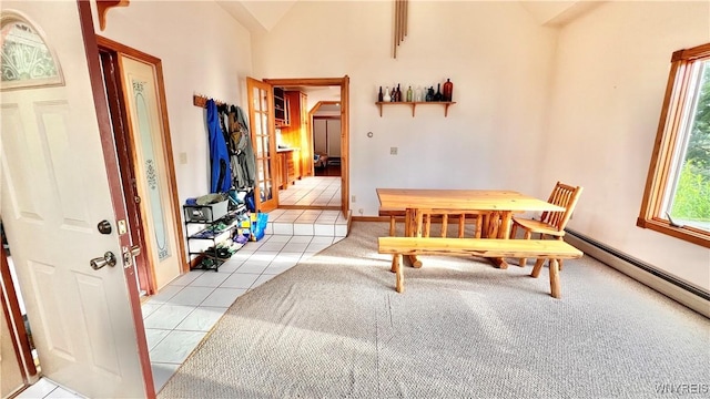 7320 E Flats Rd, East Otto, NY 14729 - entryway featuring light tile patterned floors, vaulted ceiling, and baseboard heating
