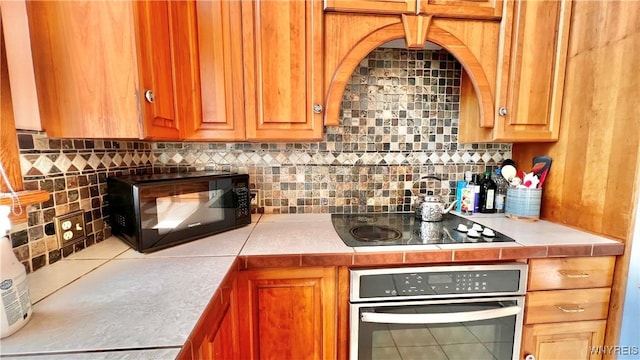 7320 E Flats Rd, East Otto, NY 14729 - kitchen with black appliances and backsplash