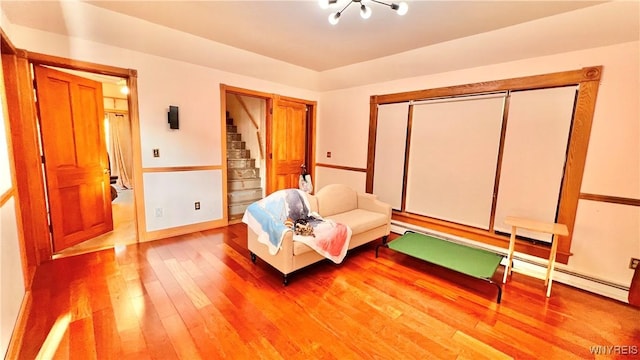 7320 E Flats Rd, East Otto, NY 14729 - sitting room with hardwood / wood-style flooring and stairway