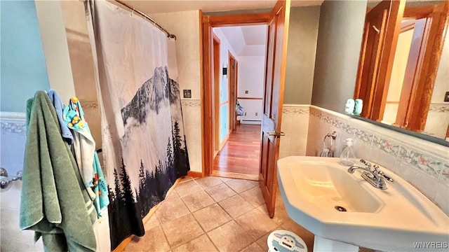 7320 E Flats Rd, East Otto, NY 14729 - bathroom featuring wainscoting, baseboard heating, a shower with curtain, and tile patterned floors
