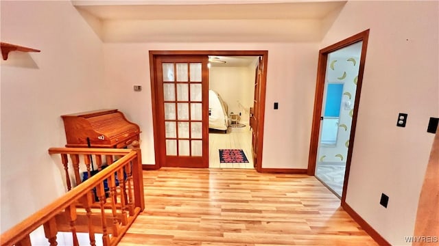 7320 E Flats Rd, East Otto, NY 14729 - hall with light wood-style flooring and french doors