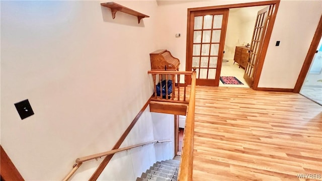 7320 E Flats Rd, East Otto, NY 14729 - stairs featuring wood finished floors and french doors