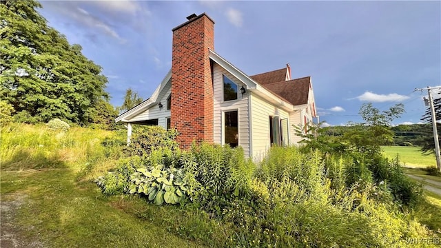 7320 E Flats Rd, East Otto, NY 14729 - view of side of property with a chimney