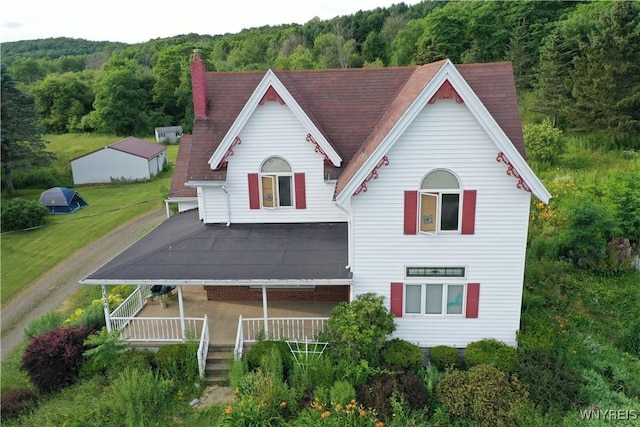 7320 E Flats Rd, East Otto, NY 14729 - view of front of property with a forest view and a chimney