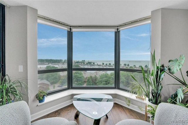 803 Admirals Walk Unit 803, Buffalo, NY 14202 - sitting room with a water view and wood finished floors