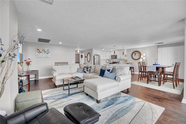 803 Admirals Walk Unit 803, Buffalo, NY 14202 - living room featuring dark wood-type flooring and recessed lighting