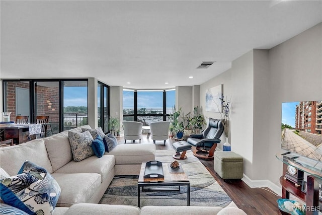 803 Admirals Walk Unit 803, Buffalo, NY 14202 - living area with wood finished floors, recessed lighting, and floor to ceiling windows