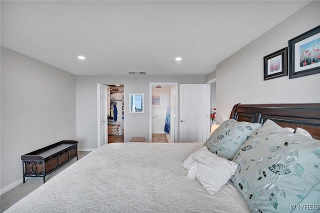 803 Admirals Walk Unit 803, Buffalo, NY 14202 - bedroom with recessed lighting, carpet flooring, a walk in closet, and ensuite bathroom