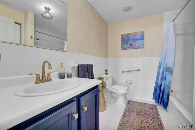 803 Admirals Walk Unit 803, Buffalo, NY 14202 - full bath with tile walls, vanity, shower / bath combo with shower curtain, tile patterned floors, and wallpapered walls