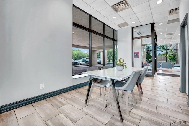 803 Admirals Walk Unit 803, Buffalo, NY 14202 - dining area with plenty of natural light, floor to ceiling windows, recessed lighting, and wood tiled floors