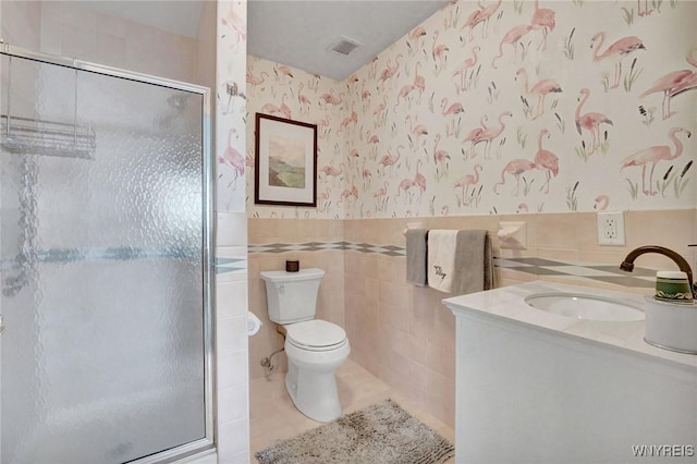803 Admirals Walk Unit 803, Buffalo, NY 14202 - bathroom with a shower stall, wallpapered walls, vanity, tile walls, and tile patterned floors