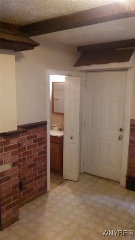 184 Goundry St, North Tonawanda, NY 14120 - finished below grade area featuring light flooring and brick wall