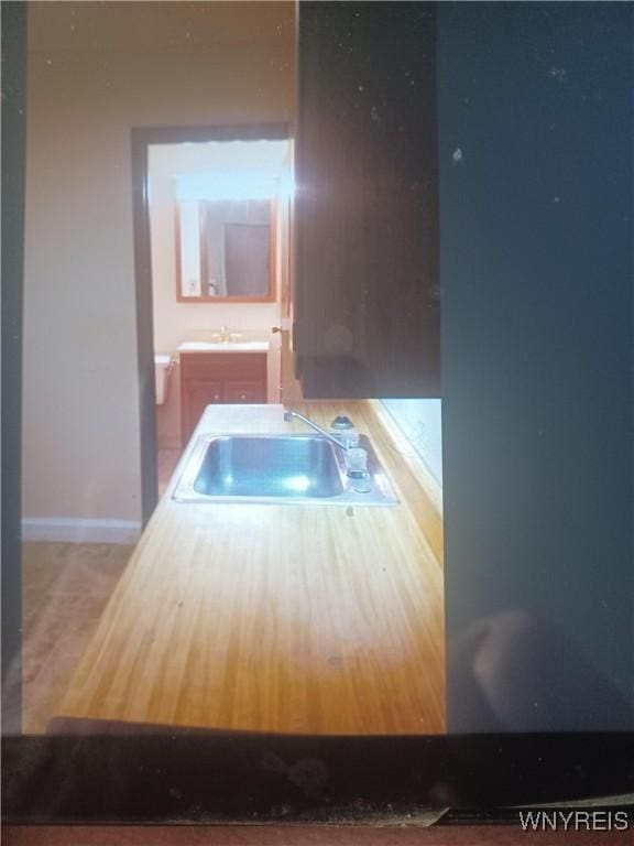 184 Goundry St, North Tonawanda, NY 14120 - kitchen with a sink and baseboards