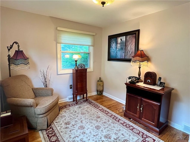 206 Wembridge Dr, Dewitt, NY 13057 - sitting room with light wood-type flooring and baseboards
