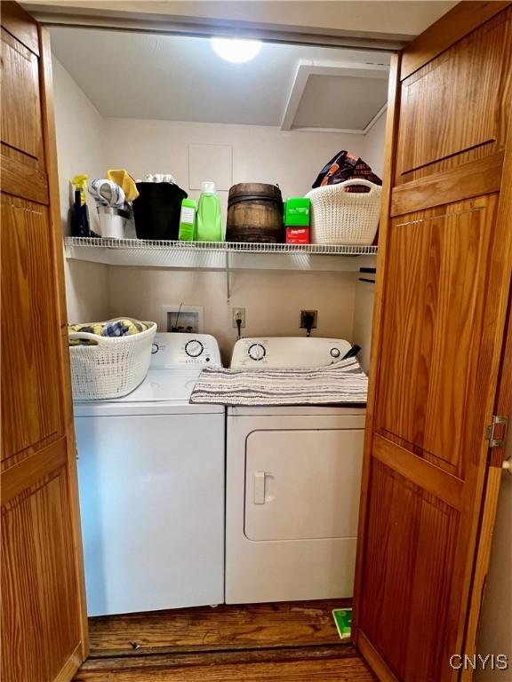 206 Wembridge Dr, Dewitt, NY 13057 - laundry area featuring washer and dryer and wood finished floors