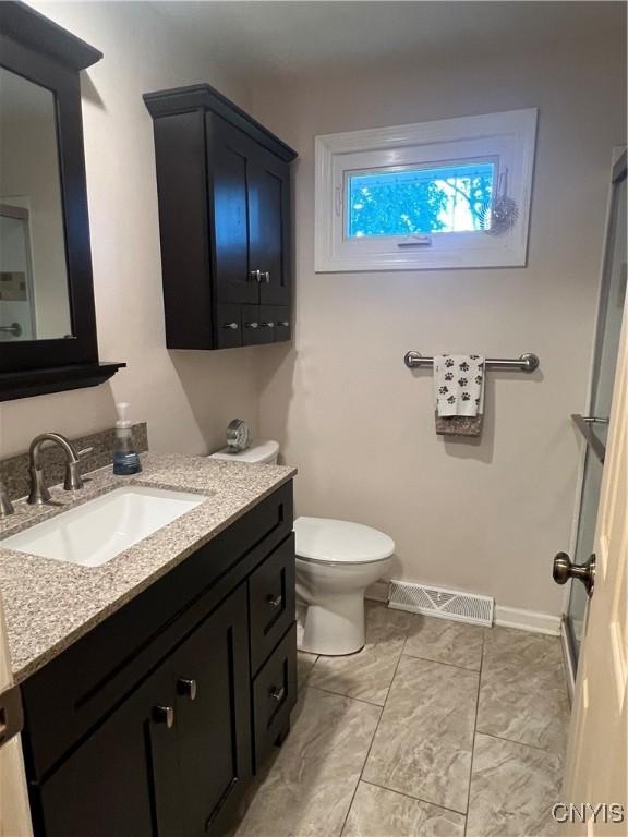 206 Wembridge Dr, Dewitt, NY 13057 - bathroom featuring vanity and toilet