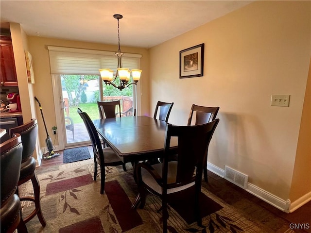 206 Wembridge Dr, Dewitt, NY 13057 - dining space featuring a chandelier and dark wood-style floors
