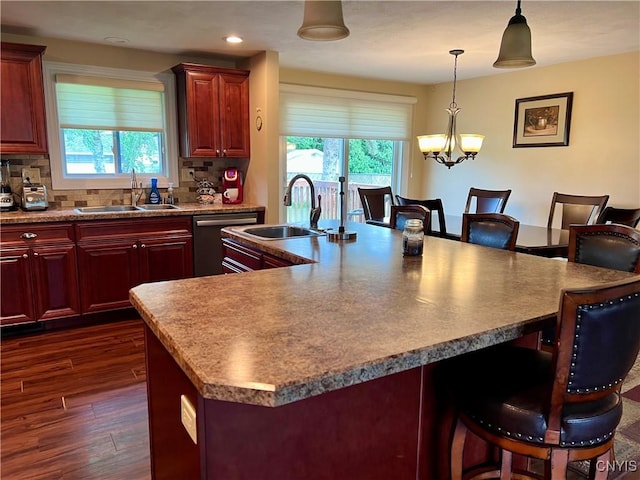 206 Wembridge Dr, Dewitt, NY 13057 - kitchen featuring stainless steel dishwasher, a breakfast bar area, healthy amount of natural light, and recessed lighting