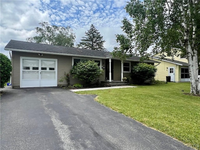 206 Wembridge Dr, Dewitt, NY 13057 - ranch-style home featuring a garage, asphalt driveway, and a front yard