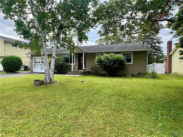 206 Wembridge Dr, Dewitt, NY 13057 - view of front of home with an attached garage and asphalt driveway