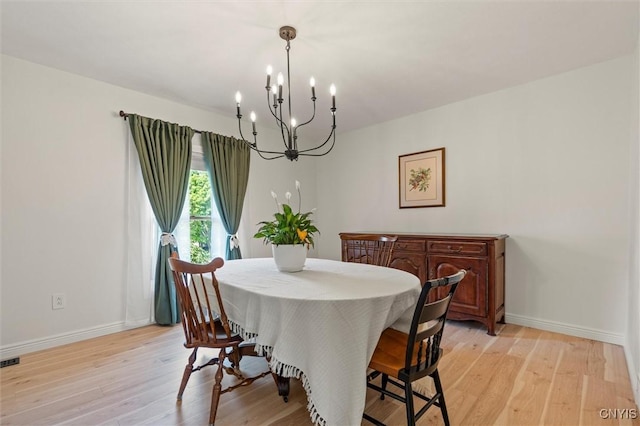 124 Morgan Ln, Oneida, NY 13421 - dining room featuring a chandelier and light wood-type flooring