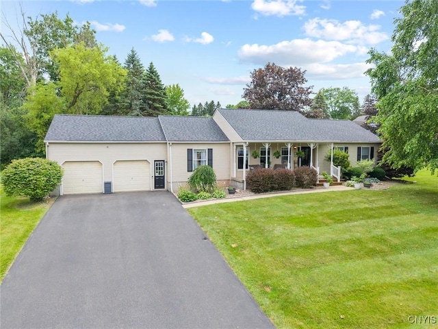 124 Morgan Ln, Oneida, NY 13421 - ranch-style home with a garage, a front lawn, asphalt driveway, and covered porch