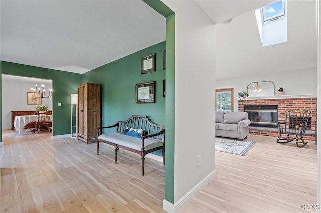 124 Morgan Ln, Oneida, NY 13421 - hall with wood finished floors, a chandelier, and a skylight