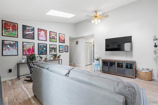 124 Morgan Ln, Oneida, NY 13421 - living area featuring a skylight, a ceiling fan, wood finished floors, and high vaulted ceiling