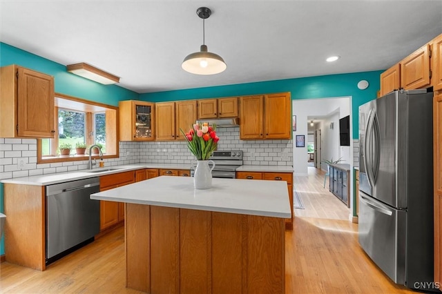 124 Morgan Ln, Oneida, NY 13421 - kitchen featuring stainless steel appliances, light countertops, light wood-style floors, backsplash, and recessed lighting