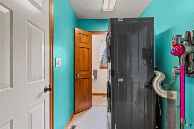 124 Morgan Ln, Oneida, NY 13421 - washroom featuring estacked washer and dryer and light carpet