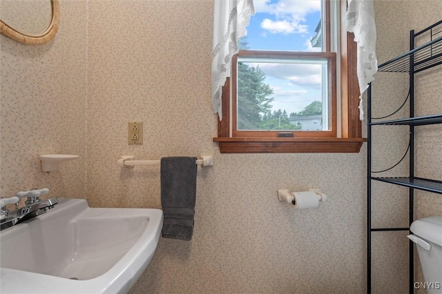 124 Morgan Ln, Oneida, NY 13421 - half bath featuring a sink and wallpapered walls