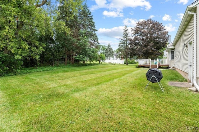 124 Morgan Ln, Oneida, NY 13421 - view of green lawn with a wooden deck