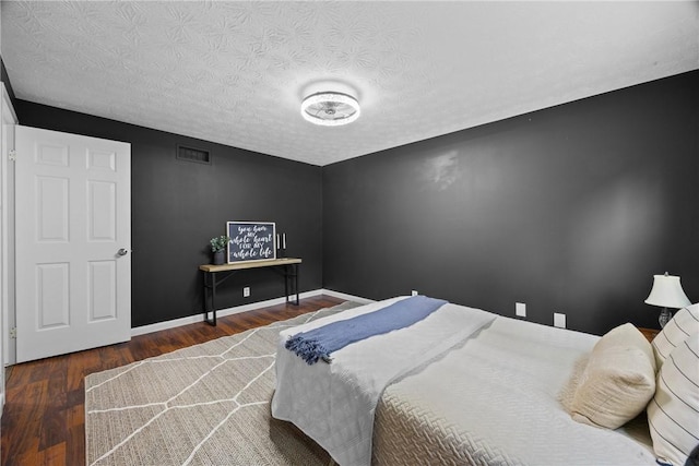 911 Copperkettle Rd, Webster, NY 14580 - bedroom featuring wood finished floors and a textured ceiling