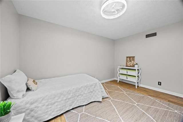 911 Copperkettle Rd, Webster, NY 14580 - bedroom featuring wood finished floors and baseboards