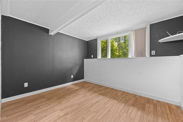 911 Copperkettle Rd, Webster, NY 14580 - spare room featuring wood finished floors and a textured ceiling