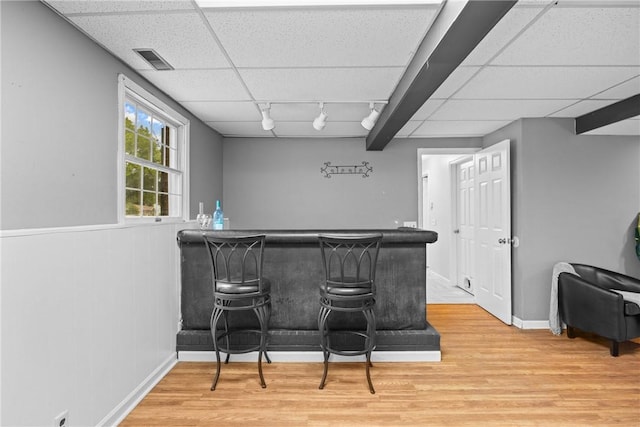 911 Copperkettle Rd, Webster, NY 14580 - indoor dry bar with wood finished floors, track lighting, a drop ceiling, and a wainscoted wall